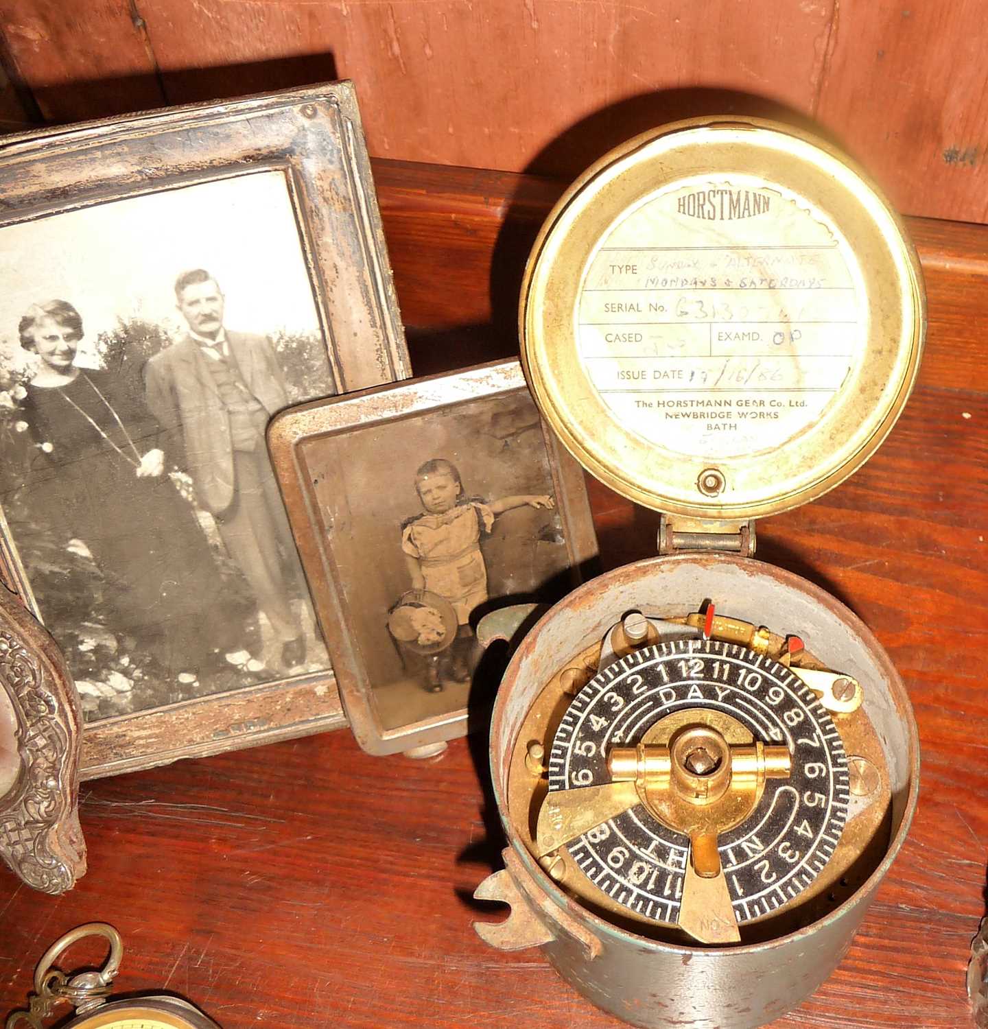 Silver handled cake slice, pocket watches, old framed photos and some time stamp clocks - Image 4 of 6