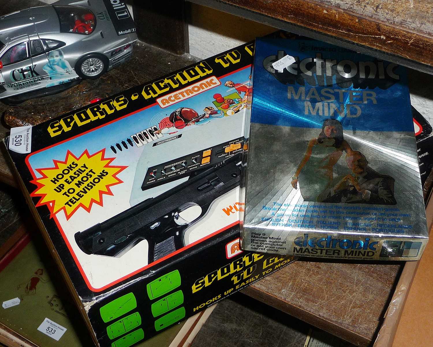 Vintage Electronic Mastermind game, and a Sports Action Acetronic TV game in box