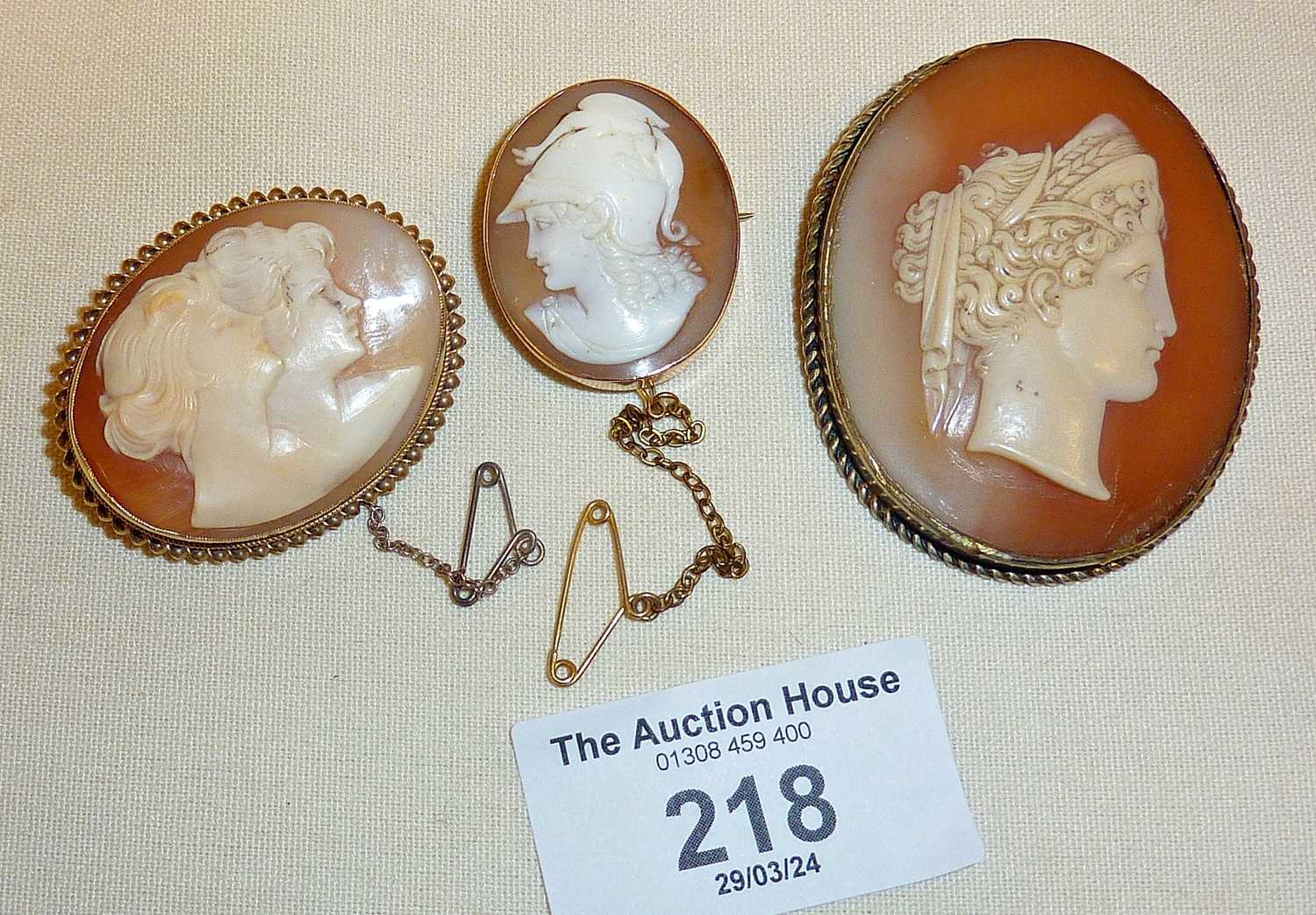 Three antique shell cameo brooches, largest finely carved classical lady profile - approx. 5cm high,