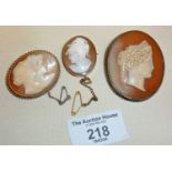 Three antique shell cameo brooches, largest finely carved classical lady profile - approx. 5cm high,