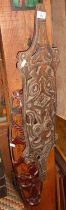 Tribal Art: Maori design carved wood shield and an African open carved hardwood mask
