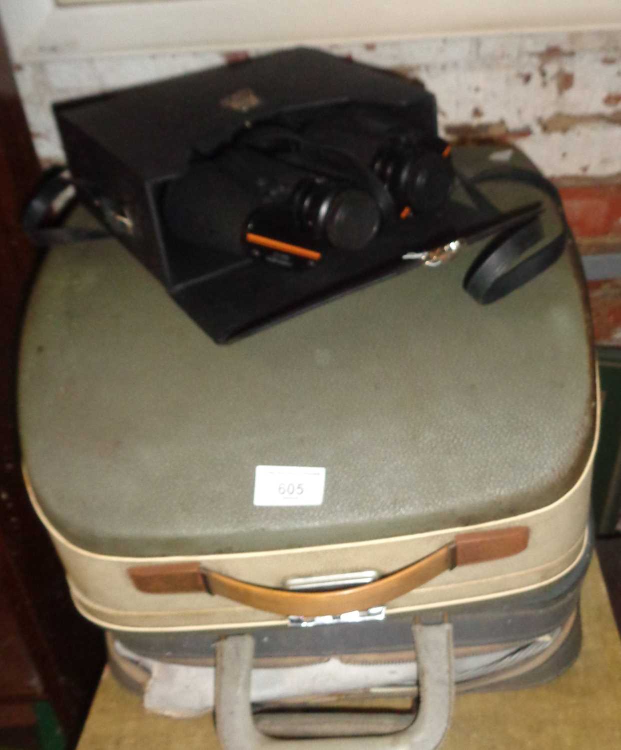 Two vintage typewriters and a pair of modern Prinz binoculars