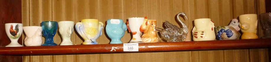 Collection of china, pottery and glass egg cups (14)