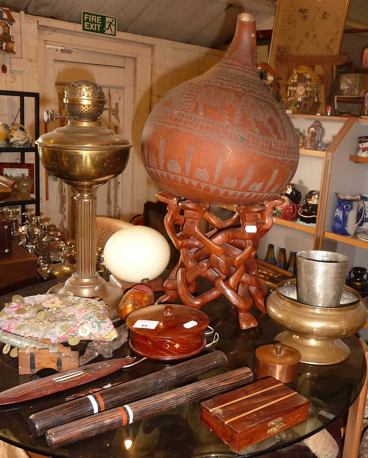 Assorted wooden items, an Ostrich egg, African carved hardwood stand and a large gourd with