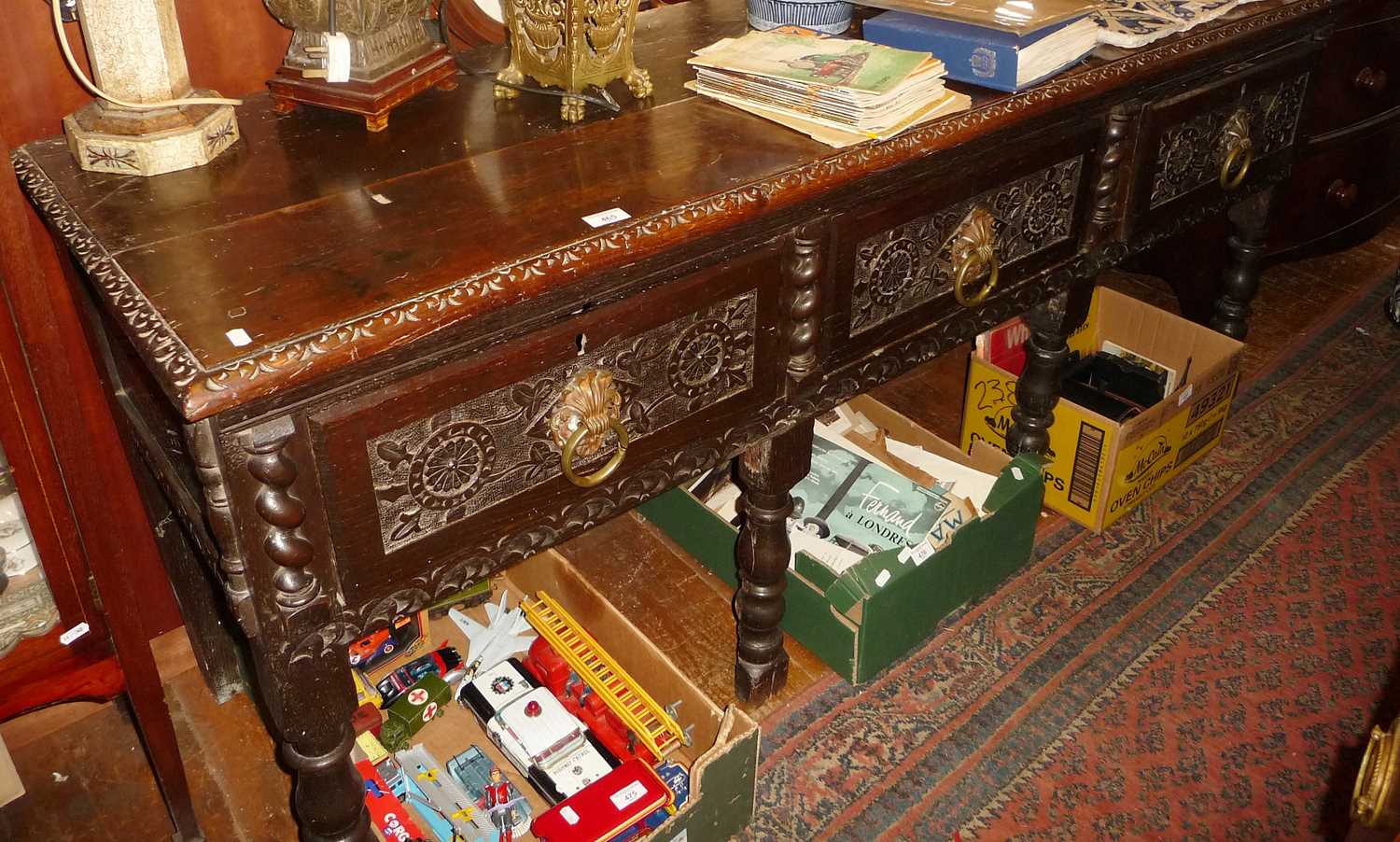 Early 19th c. carved oak low dresser base with three drawers, approx. 180cm long