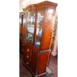 Edwardian mahogany breakfront bookcase with glazed bow fronted upper section above three drawers