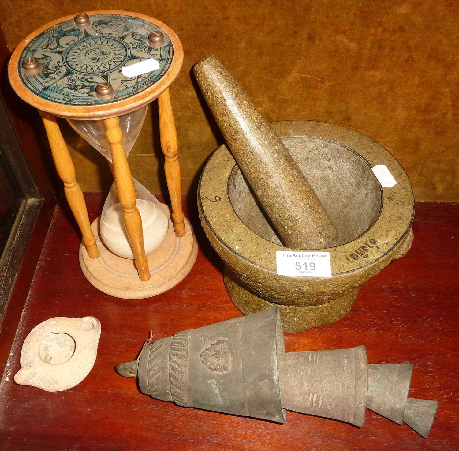 Carved granite pestle and mortar, large egg timer, and a 4-tier heavy metal Middle Eastern camel