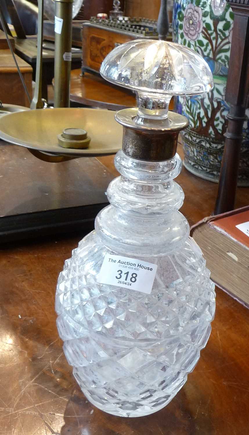 Silver collared three knop cut glass decanter