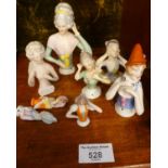 Various German porcelain pincushion dolls