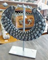 Tribal Art: a Miao silver metal body ornament displayed on stand
