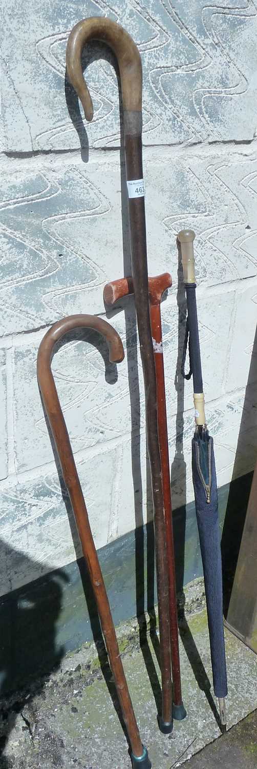 Shepherd's crook, horn handled ladies umbrella and two walking sticks