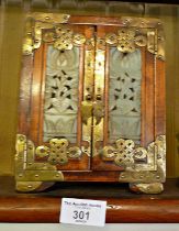 Chinese jewellery cabinet with brass mounts and jade inset doors enclosing three drawers, 18cm