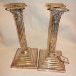 Victorian pair of tall columnar silver candlesticks with weighted bases, approx. 27cm high, and