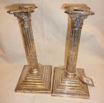 Victorian pair of tall columnar silver candlesticks with weighted bases, approx. 27cm high, and