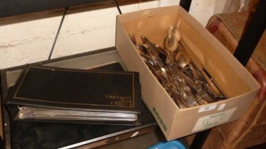 A quantity of stainless steel cutlery by Smith Seymour Ltd of Sheffield, together with an album of