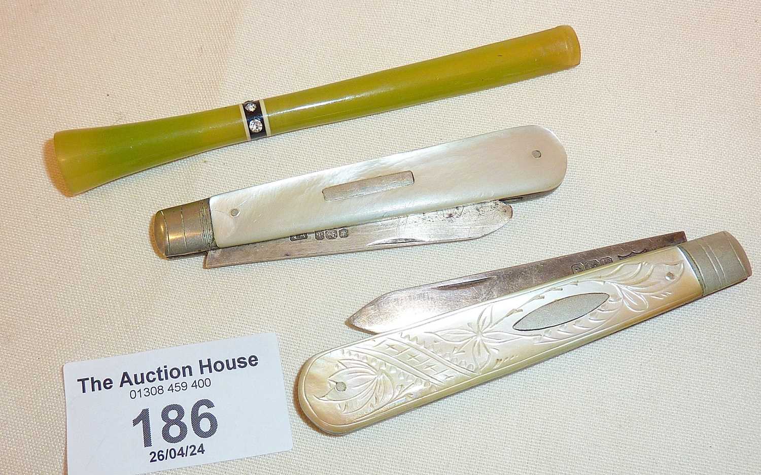 Art Deco green catalin long cigarette holder and two antique mother of pearl cased fruit or pen