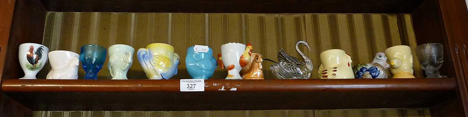 Collection of china, pottery and glass egg cups (14)