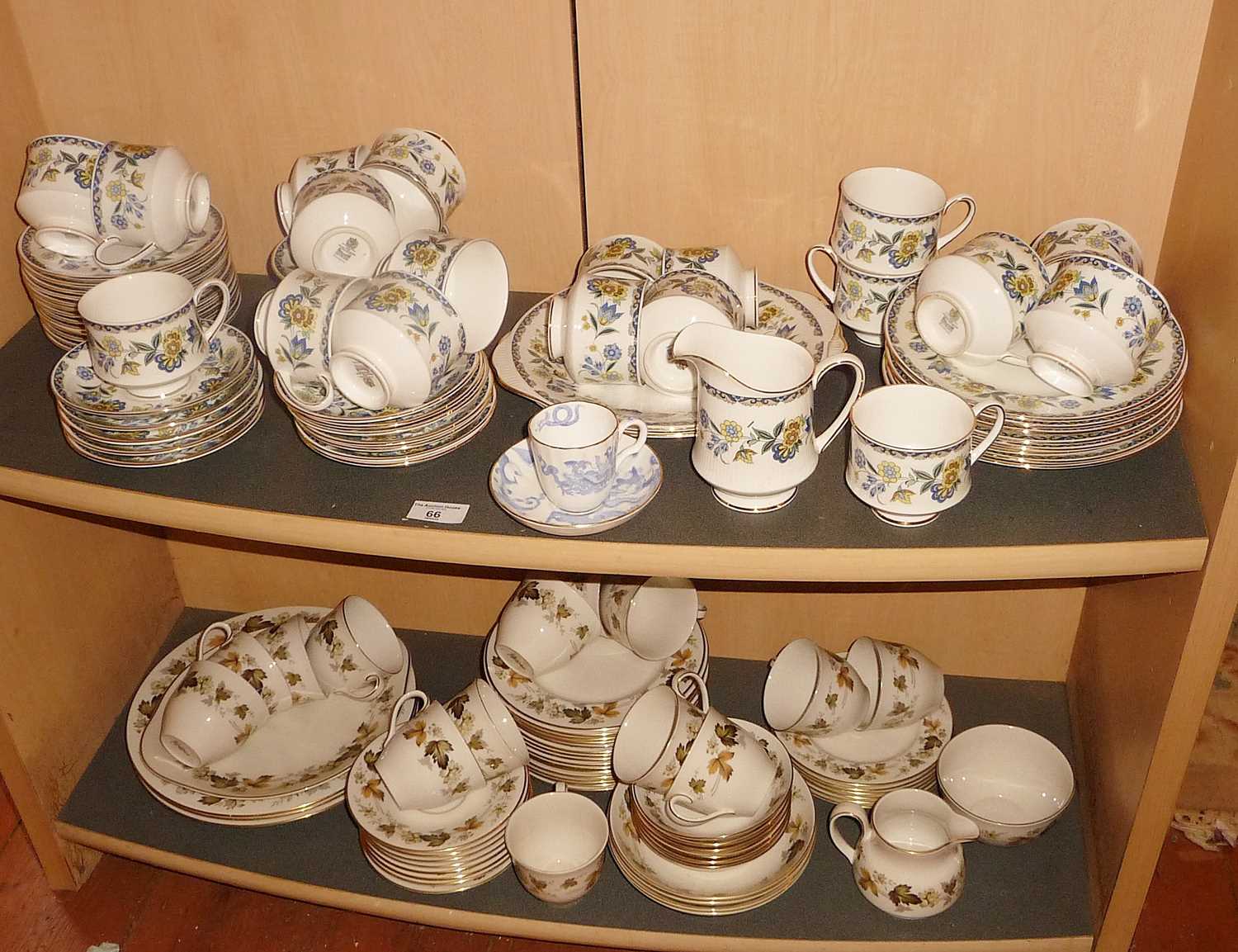 Extensive Paragon "Contessa" tea set and a similar Royal Doulton "Larchmont" tea set (two shelves)