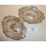 Edwardian pair of silver pin dishes with pierced and repousse decoration, hallmarked for Sheffield