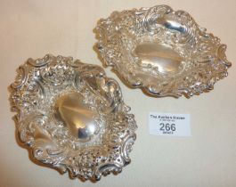 Edwardian pair of silver pin dishes with pierced and repousse decoration, hallmarked for Sheffield