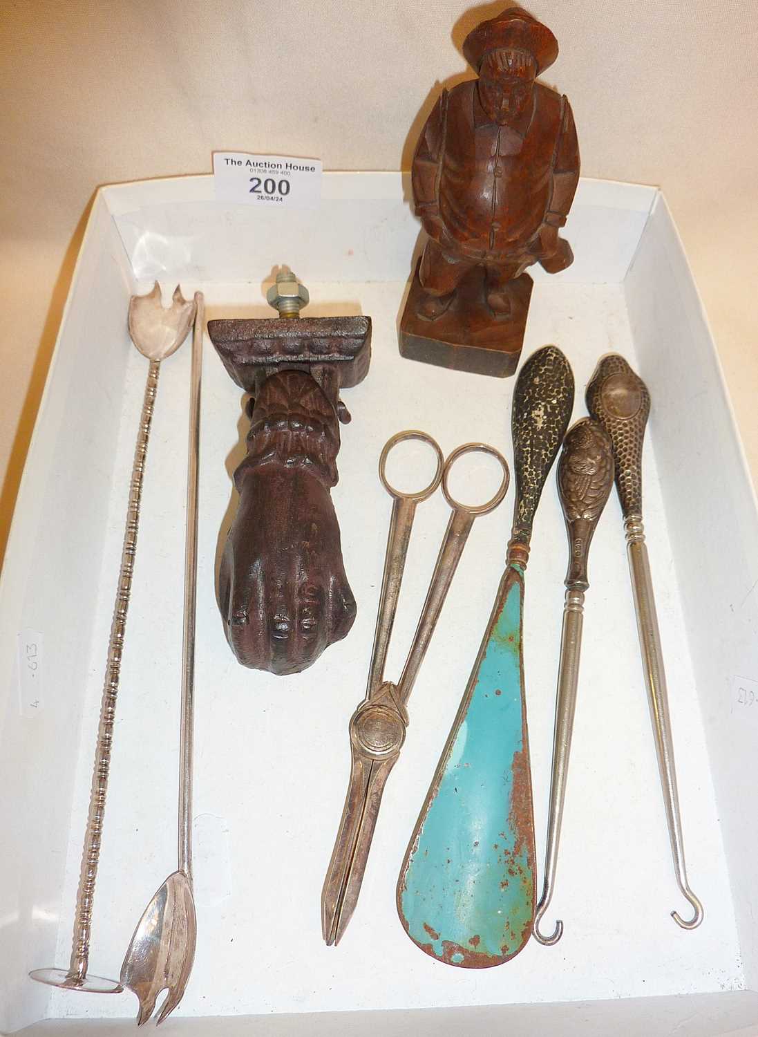 Anri carving of man, silver handled button hooks and shoe horn, cocktail stirrers, grape scissors