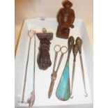 Anri carving of man, silver handled button hooks and shoe horn, cocktail stirrers, grape scissors