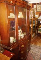 Edwardian mahogany breakfront bookcase with glazed bow fronted upper section above three drawers
