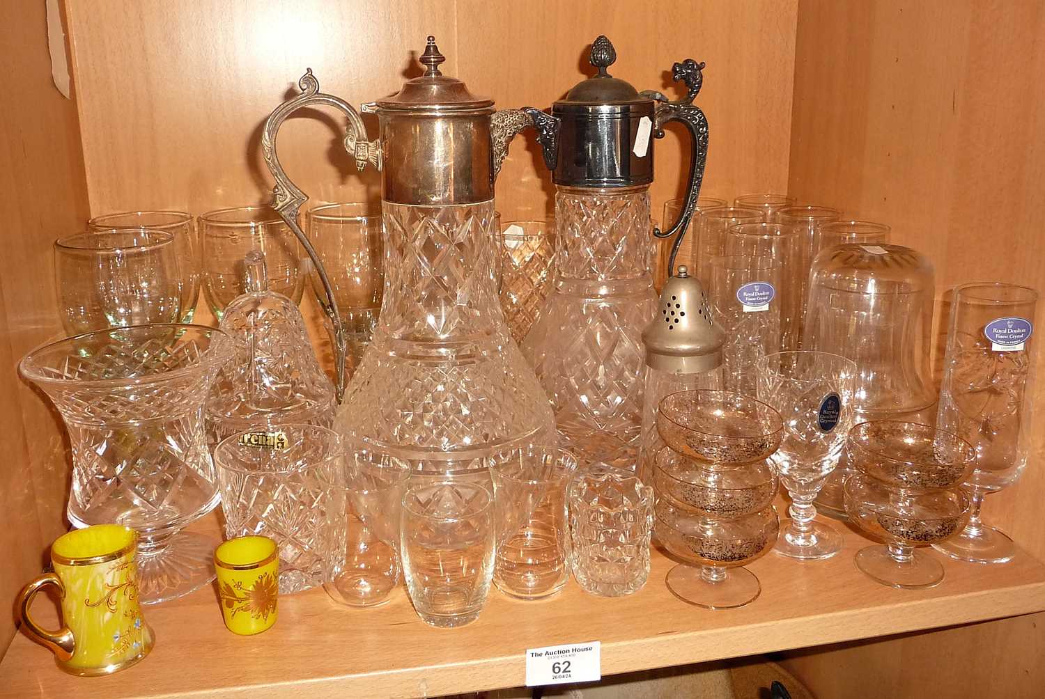Two claret jugs with silver plated mounts and a quantity of wine glasses, etc.