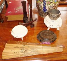 Four Chinese hardwood stands, a pewter mounted bowl with dragons and a wooden fan