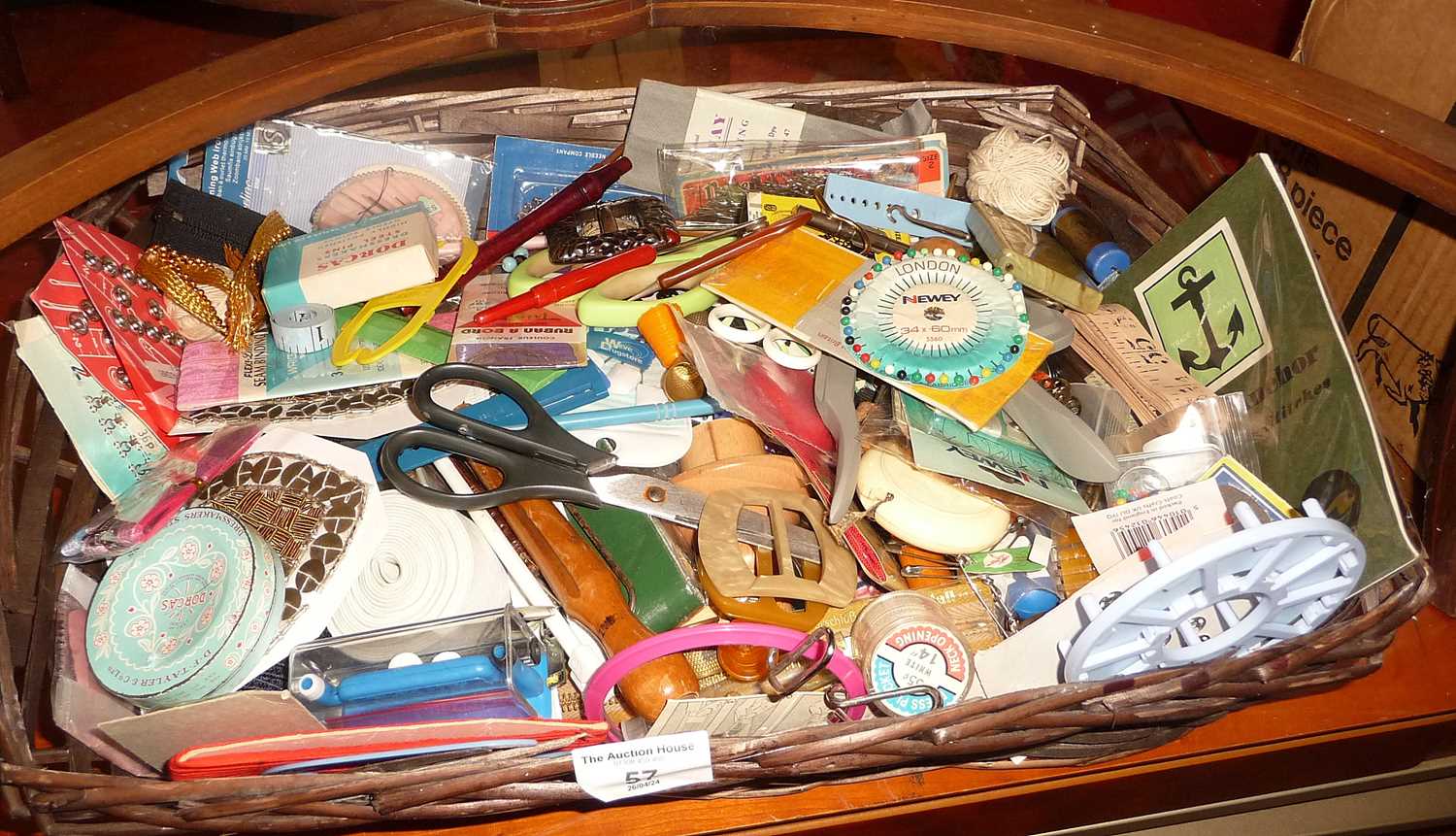 Basket of assorted haberdashery and sewing accessories