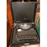 A vintage Corona portable typewriter in black enamel with case