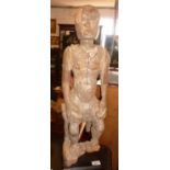 Tribal Art: Ancient African carved wood figure, 70cm high. on museum type plinth