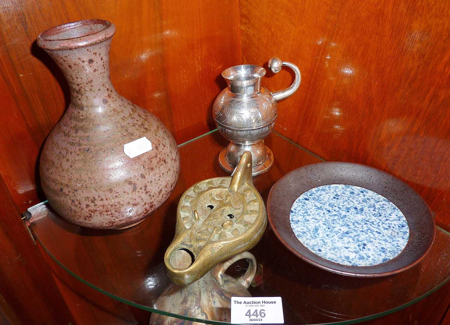South American white metal or silver mate vessels, a Romanesque bronze spirit lamp, a Studio Pottery