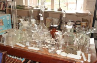 Large collection of chemistry and scientific glass jars, pestles and mortars, test tubes etc
