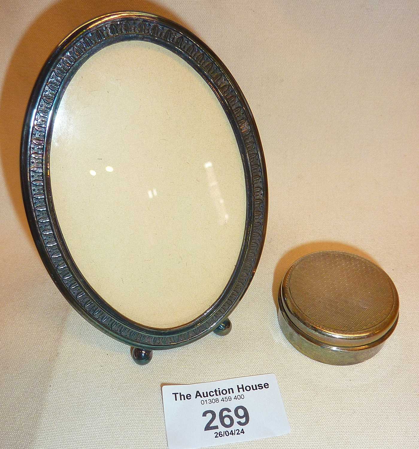 White metal photo frame and a hallmarked silver pill box