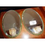 Pair of 1930's oval mirrors with candle holders