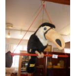 Merrythought toucan on a swinging perch