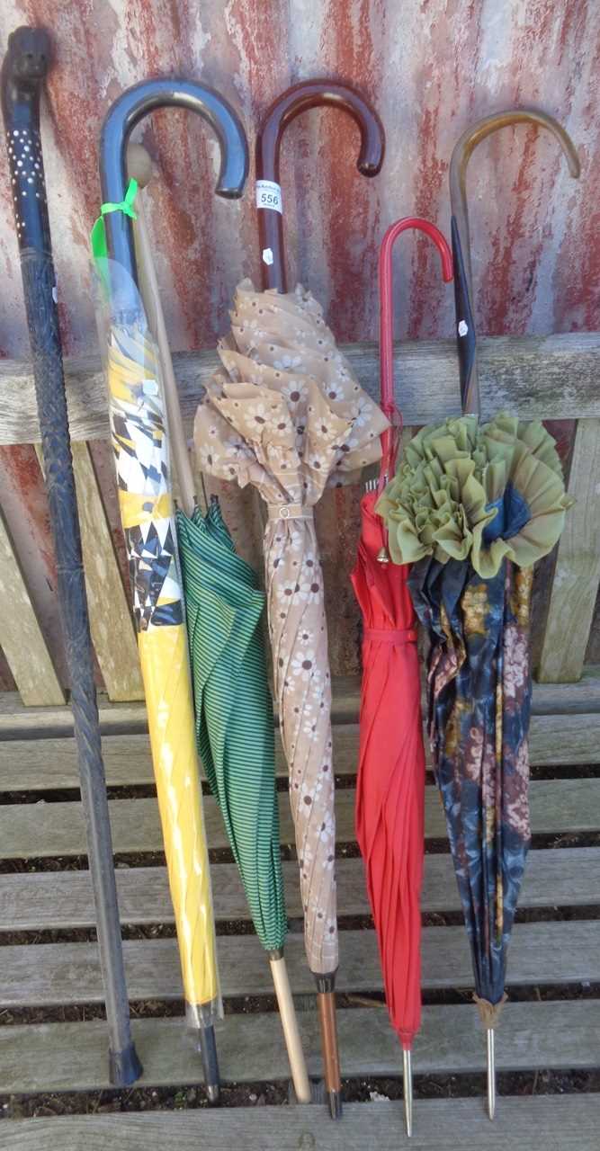 Five various umbrellas and parasols, etc.