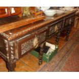 18th c carved oak dresser base, 6ft wide x 22" deep x 31" high, having three drawers with brass ring