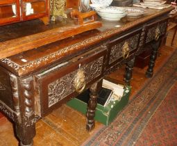 18th c carved oak dresser base, 6ft wide x 22" deep x 31" high, having three drawers with brass ring