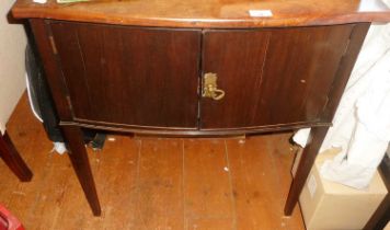 Edwardian mahogany two-door bow fronted cupboard on square tapering legs