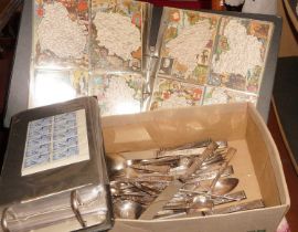 A quantity of stainless steel cutlery by Smith Seymour Ltd of Sheffield, together with an album of