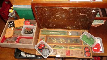 Original wood Meccano box of parts, bolts and wheels, etc. with trays of similar red and green
