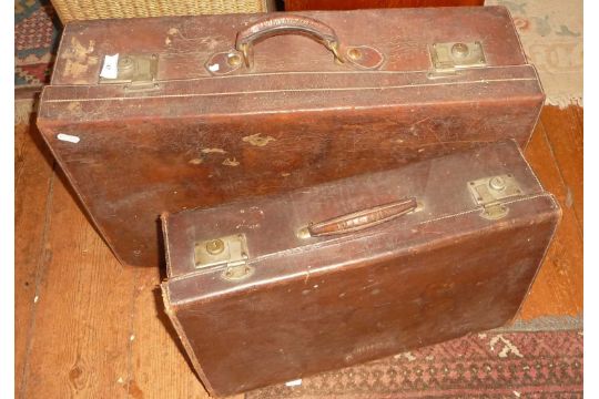 Two vintage leather suitcases