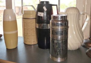 Four mid century Thermos flasks and a Thermos jug