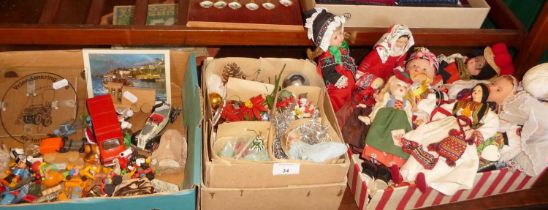 Souvenir dolls in national costumes, vintage Christmas decorations and a box of plastic toy