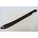 A 19th century machete with 55 cm (l) single fullered blade and ribbed horn grips,