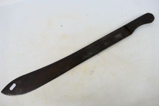 A 19th century machete with 55 cm (l) single fullered blade and ribbed horn grips,