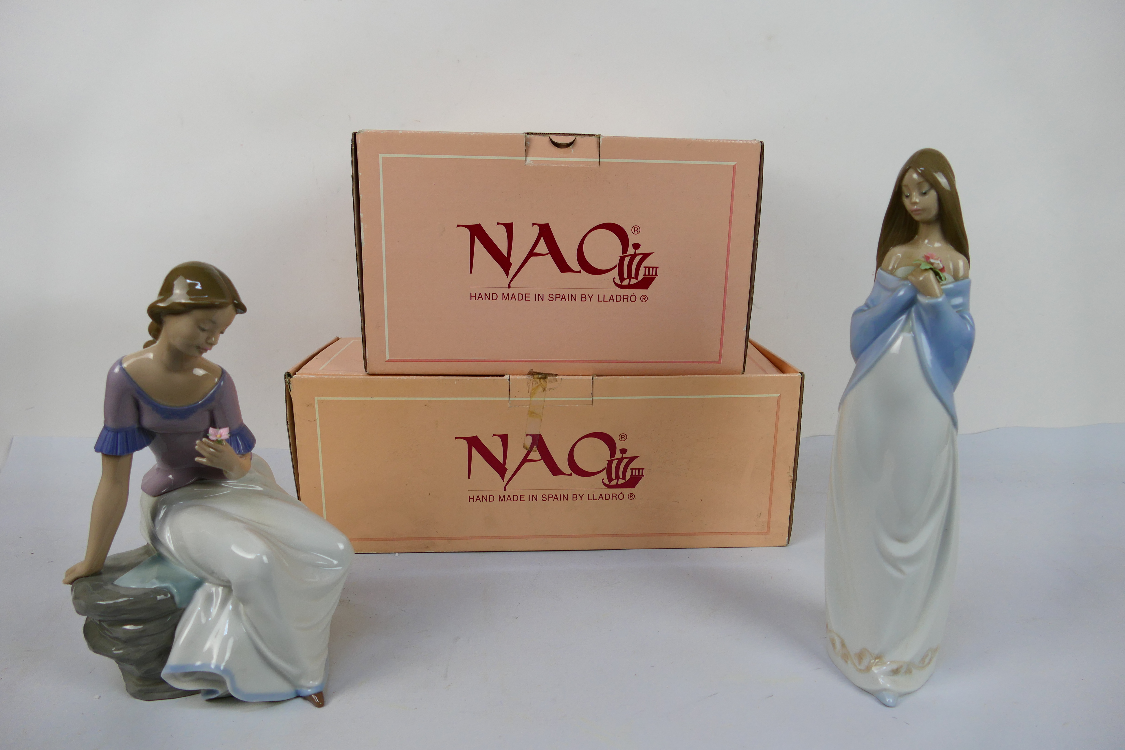 Two boxed Nao figures comprising # 1392 and # 1344, largest approximately 31 cm (h). [2].