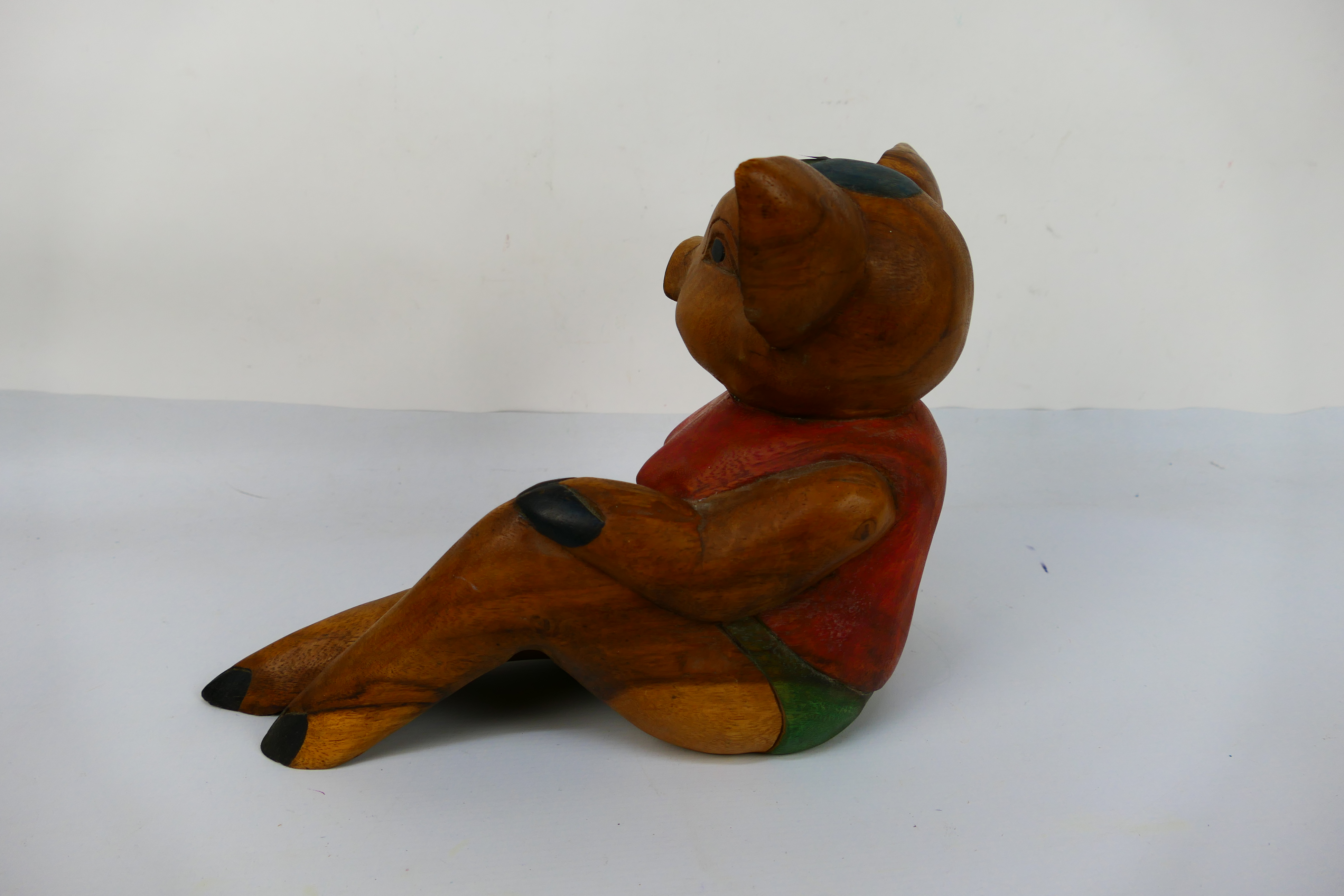 A carved wood anthropomorphic pig, 26 cm (h). [W]. - Image 2 of 2